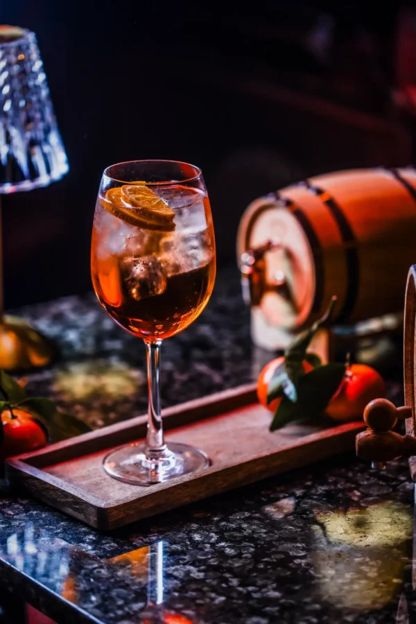 An Aperol spritz cocktail on a wooden tray at The Hercules Pillars, Holborn, available for £5 on Mondays