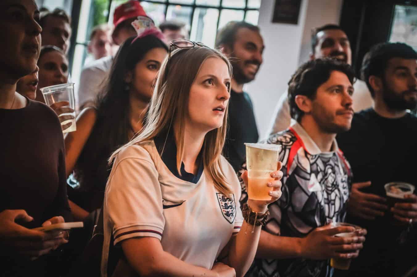 A packed interior at St Christopher's Pub London Bridge with fans watching live sport on a large projector screen